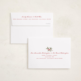 This is a mistletoe petite holiday cards with standard by Wildfield Paper Co called poinsettia + pine printing on recycled smooth signature in petite