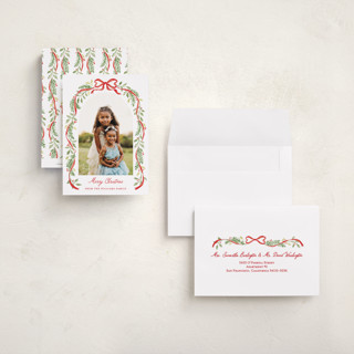 This is a cardinal petite holiday cards with standard by Sarah Knight called ribbon arch printing on recycled smooth signature in petite