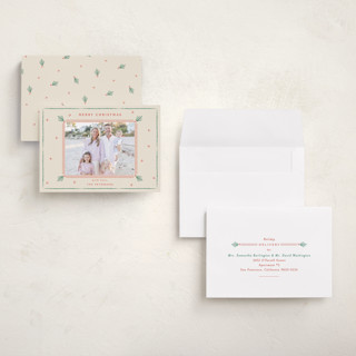 This is a holly petite holiday cards with standard by Sarah Rosenthal called holly tidings printing on signature in petite