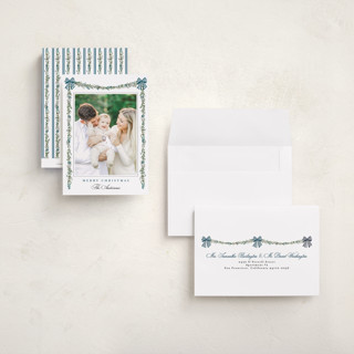 This is a winter berry petite holiday cards with standard by Susan Moyal called holly & bows printing on recycled smooth signature in petite