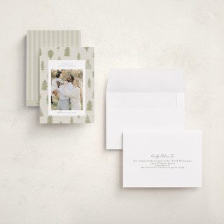 This is a greenery petite holiday cards with standard by Heather Cairl called all evergreen printing on recycled smooth signature in petite