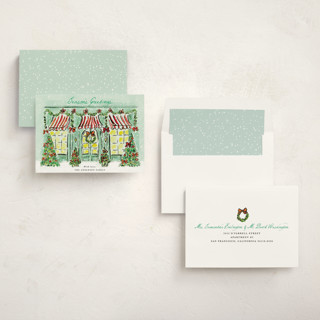 This is a frosted mint non photo holiday cards with standard by Cass Loh called the jolly storefront printing on signature in standard