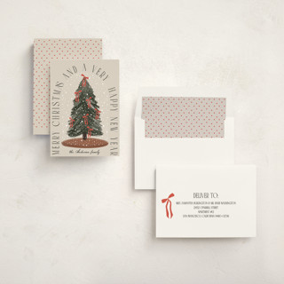 This is a buttercream non photo holiday cards with standard by Maja Cunningham called snowglobe printing on signature in standard