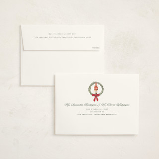 This is a berry non photo holiday cards with standard by Teju Reval called nutcracker wreath printing on signature in standard