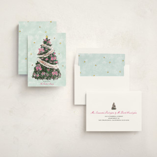 This is a winter rose non photo holiday cards with standard by Cass Loh called evergreen magic printing on signature in standard