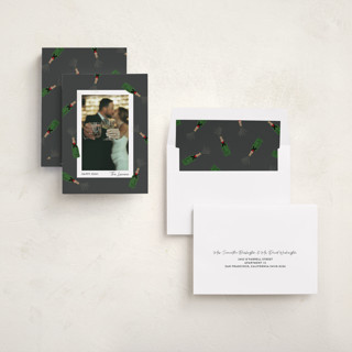 This is a charcoal new year photo cards with standard by Shari Margolin called popping bottles printing on recycled smooth signature in standard