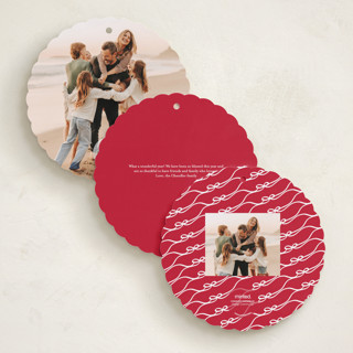 This is a cardinal holiday card ornaments with standard by Kaydi Bishop called bow tied printing on recycled smooth signature in ornament