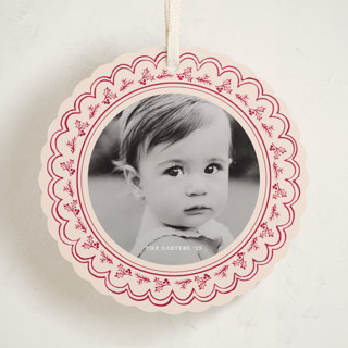 This is a cranberry holiday card ornaments with standard by Teju Reval called scalloped holly printing on recycled smooth signature in ornament