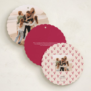 This is a cranberry holiday card ornaments with standard by Teju Reval called scalloped holly printing on recycled smooth signature in ornament
