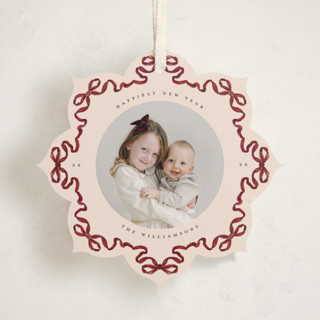 This is a cranberry holiday card ornaments with standard by Jenna Holcomb called bow ornament printing on recycled smooth signature in ornament