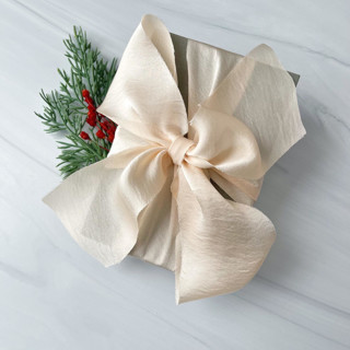 This is a white holiday decorations by Honey Silks Co called 2" holiday ribbon collection - eggnog in standard