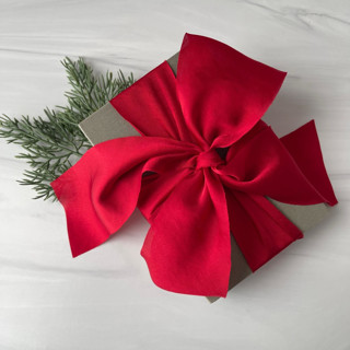 This is a red holiday decorations by Honey Silks Co called 2" holiday ribbon collection - winter ruby in standard
