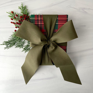 This is a green holiday decorations by Honey Silks Co called olive 2" x 15 ft holiday ribbon in standard