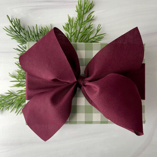 This is a purple holiday decorations by Honey Silks Co called sugar plum 2" x 15 ft holiday ribbon in standard