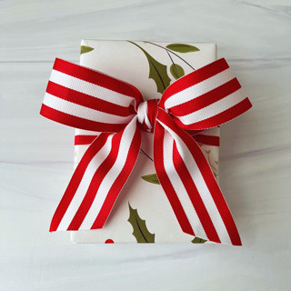 This is a red holiday decorations by Honey Silks Co called bold stripe holiday 1.5" x 5 yards in standard
