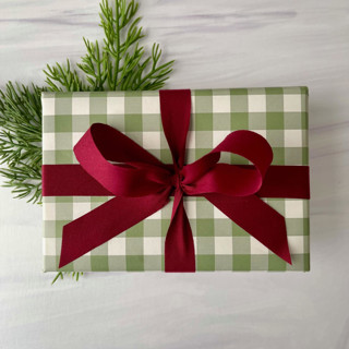 This is a red holiday decorations by Honey Silks Co called burgundy 3/4" x 15 ft holiday ribbon in standard