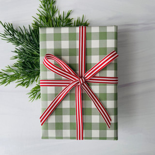 This is a red holiday decorations by Honey Silks Co called 3/8" x 15 ft red stripe holiday ribbon in standard