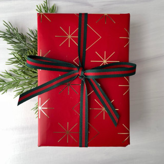 This is a red holiday decorations by Honey Silks Co called 3/8" x 15 feet hampton holiday ribbon in standard