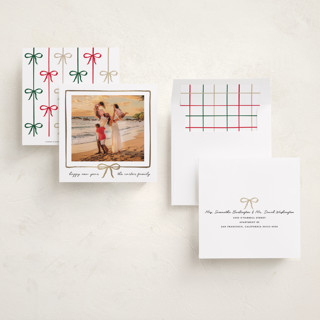 This is a snowfall foil pressed holiday cards with foil pressed by Jennifer Lew called lil bow printing on recycled smooth signature in square