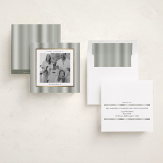 This is a sage green foil pressed holiday cards with foil pressed by Lucrecia Caporale called striped frame printing on recycled smooth signature in square