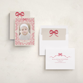 This is a poinsettia holiday photo cards with standard by Anne Ciotola called one red bow printing on recycled smooth signature in standard