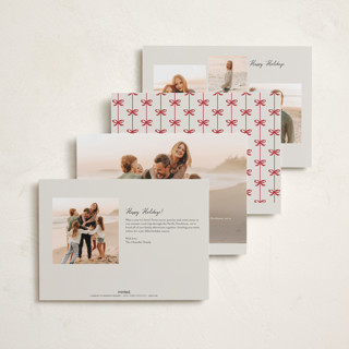 This is a poinsettia holiday photo cards with standard by Pixel and Hank called bow printing on recycled smooth signature in standard