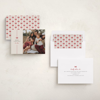 This is a poinsettia holiday photo cards with standard by Pixel and Hank called bow printing on recycled smooth signature in standard