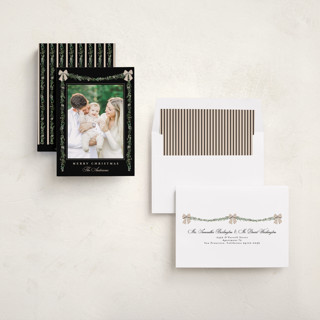 This is a coal holiday photo cards with standard by Susan Moyal called holly & bows printing on recycled smooth signature in standard