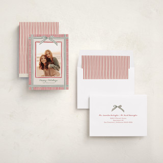 This is a ruby holiday photo cards with standard by Chris Griffith called holiday wrap printing on recycled smooth signature in standard