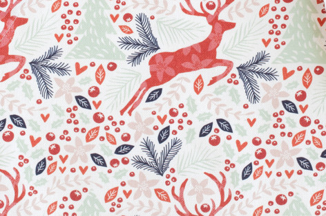 This is a red kids aprons by Phrosné Barwood called jumping reindeer in standard