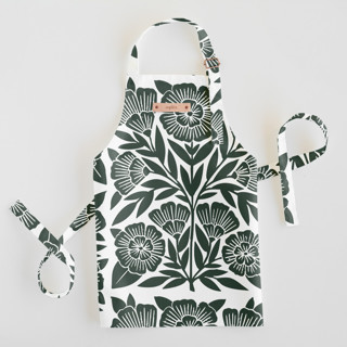 This is a dark teal kids aprons by Katharine Watson called block print floral in standard