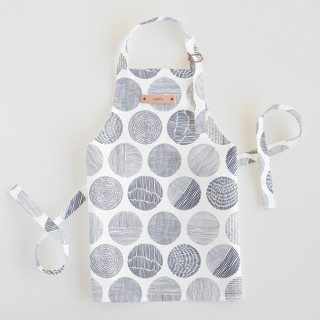 This is a navy kids aprons by Sabrin Deirani called minimalist circles in standard