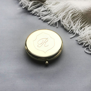 This is a multicolorassorted-colors all gifts by Charlotte Noordzij called compact mirror engraved crest in standard