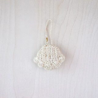 This is a natural back to school supplies by LIKHA called shell bag charm in standard
