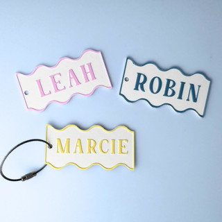 This is a white back to school supplies by Corduroy Effect called personalized swiggle keychain in standard