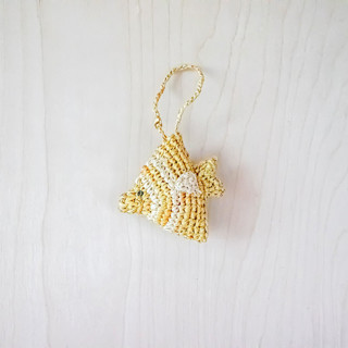 This is a yellow back to school supplies by LIKHA called fish bag charm in standard
