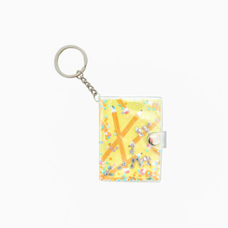 This is a yellow back to school supplies by Jollity and Co called smarty pants notebook keychain in yellow - set of 1 in standard