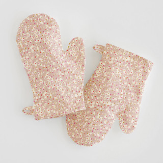 This is a tan kids aprons by Michelle Fifis called animal dots in standard