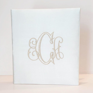 This is a white wedding gifts by Annie May called wedding memory book — ivory silk in standard