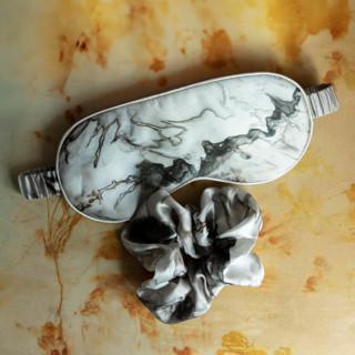 This is a white bridesmaid gifts by www.silkandwillow.com called woodgrain-sleep mask & hair scrunchie set in standard