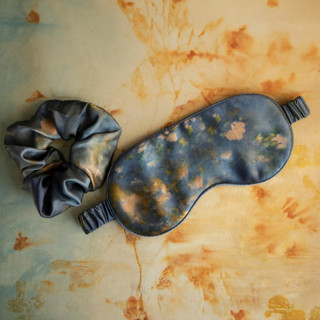 This is a blue bridesmaid gifts by www.silkandwillow.com called midnight-sleep mask & hair scrunchie set in standard