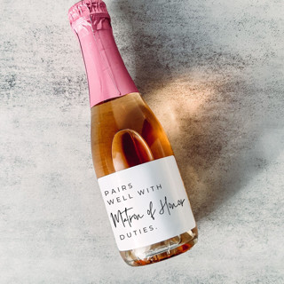 This is a white bridesmaid gifts by The Pretty Little Mess called pairs well with matron of honor duties proposal wine label in standard