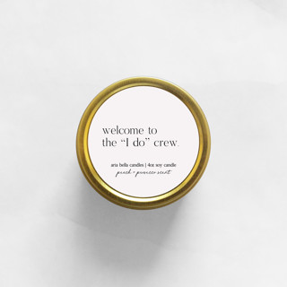 This is a gold bridesmaid gifts by Aria Bella Candles called welcome to the i do crew soy candle | gold travel tin in standard