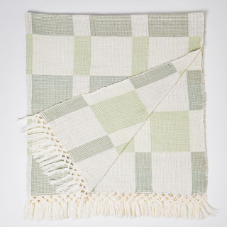 This is a green throw blankets by Tatiana Ordoñez called sumapaz large throw in sage & spring green in standard