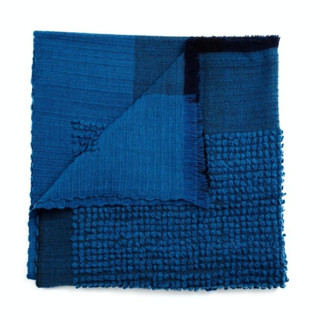 This is a blue throw blankets by Anjali Purohit called macaroon midnight dark blue plush textured handlom throw in standard