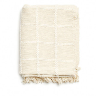 This is a white throw blankets by Anjali Purohit called sea shell white handwoven cotton throw in standard