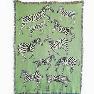 This is a green throw blankets by Olivia Wendel called green zebras blanket in standard