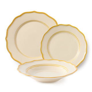 This is a yellow tableware by Maison Madison called giovanna 12 piece set with pasta bowl in standard