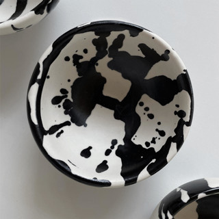 This is a black tableware by OWO Cerámica called set of 4 handmade ceramic dipping bowls - black & white splatterware in standard