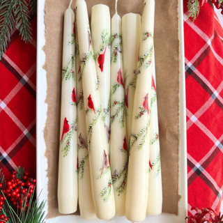 This is a beige candles and candle holders by Emily de Moraes called set of two christmas cardinal taper candles in standard